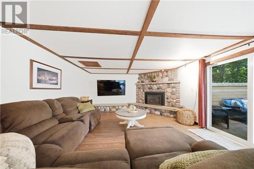 19 Government Road, Tehkummah, ON - Indoor Photo Showing Living Room With Fireplace