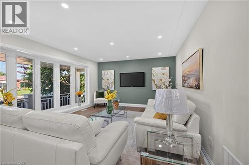 Expansive living area featuring recessed lighting, light-toned walls, and wood-finish flooring - 101 Loyalist Drive, Hamilton, ON - Indoor Photo Showing Living Room