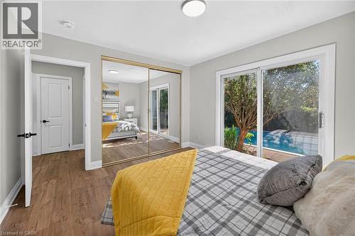 Interior room with wood-finish flooring and light gray wall paint - 101 Loyalist Drive, Hamilton, ON - Indoor Photo Showing Bedroom