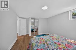 Neutral wall paint and wood-finish flooring define this interior space - 