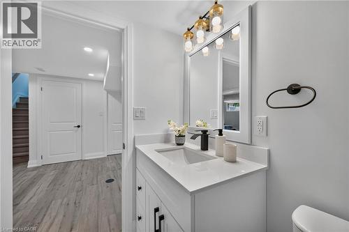 Bathroom vanity featuring a rectangular undermount sink, a matte black faucet, and a quartz countertop - 101 Loyalist Drive, Hamilton, ON - Indoor Photo Showing Bathroom