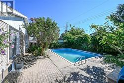 Rectangular inground pool with concrete surround - 