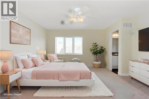 Expansive room featuring light-toned carpeting and a ceiling fan with integrated lighting - 2248 Seton Crescent, Burlington, ON - Indoor Photo Showing Bedroom