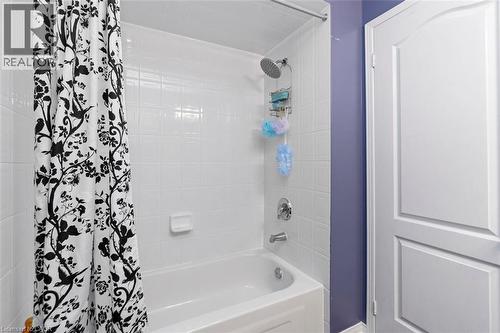 White tiled shower/tub combination with chrome fixtures - 2248 Seton Crescent, Burlington, ON - Indoor Photo Showing Bathroom