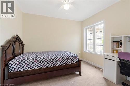 Cream-colored walls complemented by light-toned carpeting and white trim - 2248 Seton Crescent, Burlington, ON - Indoor Photo Showing Bedroom