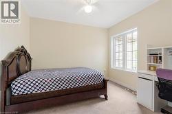 Cream-colored walls complemented by light-toned carpeting and white trim - 