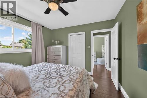 Bedroom featuring hard surface flooring, ceiling fan with integrated lighting, painted walls, and white trim - 386 Upper Kenilworth Avenue, Hamilton, ON - Indoor Photo Showing Bedroom
