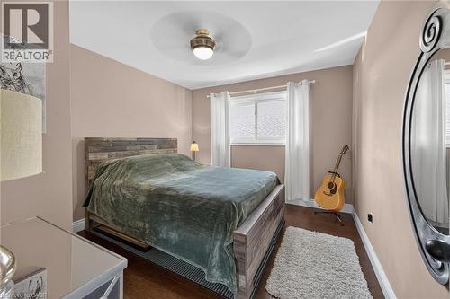 Room featuring wood-finish flooring, a contemporary ceiling fan, and painted walls - 386 Upper Kenilworth Avenue, Hamilton, ON - Indoor Photo Showing Bedroom