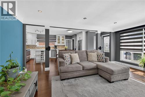 Living area featuring wood-finish flooring, recessed lighting, and a neutral color palette - 386 Upper Kenilworth Avenue, Hamilton, ON - Indoor Photo Showing Living Room