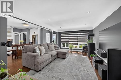 Living area featuring wood-finish flooring, recessed lighting, and a built-in fireplace - 386 Upper Kenilworth Avenue, Hamilton, ON - Indoor Photo Showing Living Room