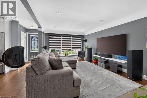 Spacious living area featuring wood-finish flooring, recessed lighting, and a neutral color palette - 386 Upper Kenilworth Avenue, Hamilton, ON - Indoor Photo Showing Other Room