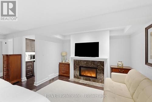 14 - 275 Pelham Road, St. Catharines (Rykert/Vansickle), ON - Indoor Photo Showing Living Room With Fireplace