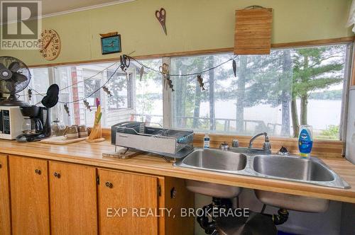 148B Oak Shores Lane, Frontenac (Frontenac South), ON - Indoor Photo Showing Kitchen With Double Sink