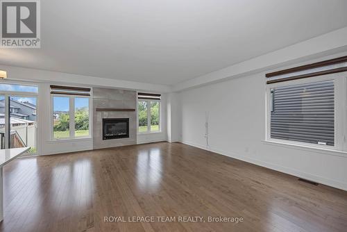779 Ovation Grove, Ottawa, ON - Indoor Photo Showing Living Room With Fireplace