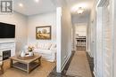 Virtually Staged - 31 Givins Street, Woodstock (Woodstock - North), ON  - Indoor Photo Showing Living Room With Fireplace 