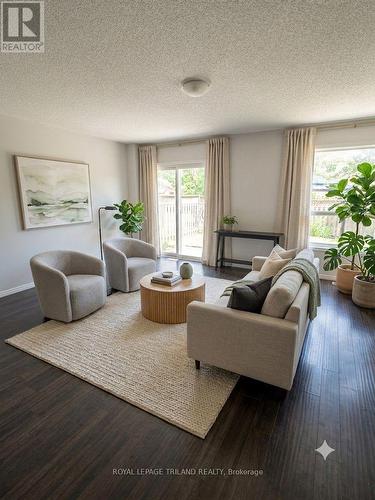 Virtually staged living room - 1942 Bloom Crescent, London North (North C), ON - Indoor Photo Showing Living Room