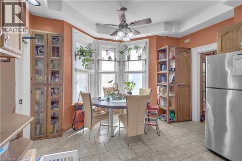 Bay window with white trim, recessed lighting, ceiling fan, tile flooring, and built-in wood-finish cabinetry - 17 Scarfe Avenue, Brantford, ON - Indoor