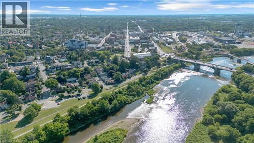 Aerial perspective showcasing a riverfront urban landscape with extensive tree canopy - 17 Scarfe Avenue, Brantford, ON - Outdoor With View