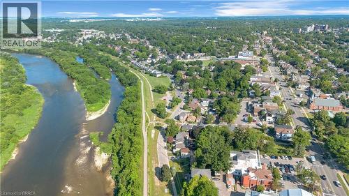 Aerial perspective showcasing a river, extensive green spaces, and a nearby urban area - 17 Scarfe Avenue, Brantford, ON - Outdoor With Body Of Water With View