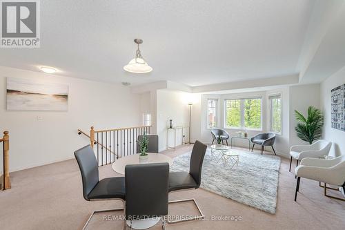Large Windows in Family Room Provide Natural Light - 3,4 - 3375 Thomas Street, Mississauga, ON - Indoor
