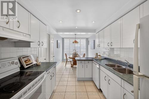 1601 - 2180 Marine Drive, Oakville, ON - Indoor Photo Showing Kitchen With Double Sink
