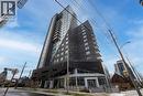 Modern high-rise building featuring a striking angular facade, extensive glass paneling, multiple balconies, and ground-level retail/commercial spaces - 158 King Street N Unit# 81201, Waterloo, ON  - Outdoor 