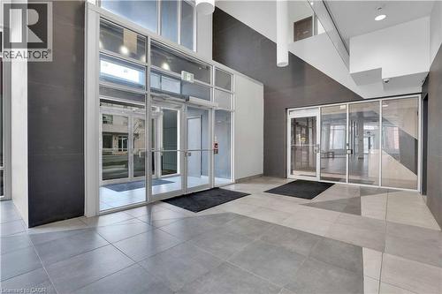 Contemporary lobby entrance featuring expansive glass doors and windows, providing abundant natural light - 158 King Street N Unit# 81201, Waterloo, ON - Indoor Photo Showing Other Room