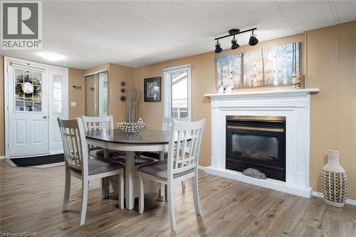580 Beaver Creek Road Unit# 189, Waterloo, ON - Indoor Photo Showing Dining Room With Fireplace