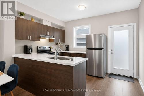 119 - 6705 Cropp Street, Niagara Falls (Morrison), ON - Indoor Photo Showing Kitchen With Double Sink