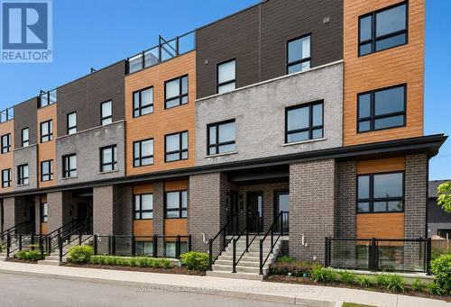 119 - 6705 Cropp Street, Niagara Falls (Morrison), ON - Outdoor With Facade