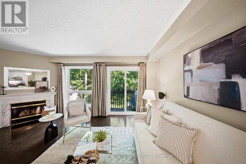 21 - 5530 Glen Erin Drive, Mississauga, ON - Indoor Photo Showing Living Room With Fireplace