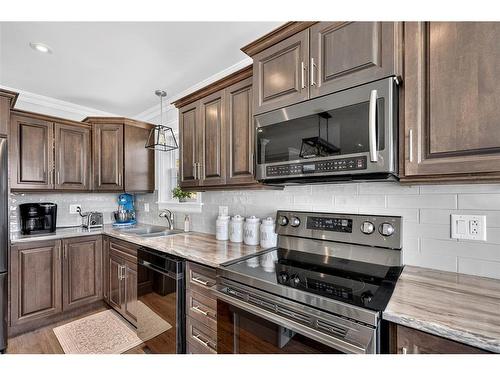 13 The Green Road, Upper Island Cove, NL - Indoor Photo Showing Kitchen With Double Sink