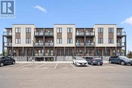 107 - 940 St David Street N, Centre Wellington (Fergus), ON - Outdoor With Balcony With Facade