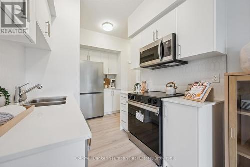 107 - 940 St David Street N, Centre Wellington (Fergus), ON - Indoor Photo Showing Kitchen With Stainless Steel Kitchen With Double Sink