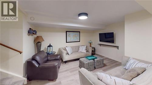 Spacious recreation room featuring light wood-finish flooring, recessed lighting, and neutral wall tones - 4101 Diana Park, Vineland, ON - Indoor Photo Showing Living Room