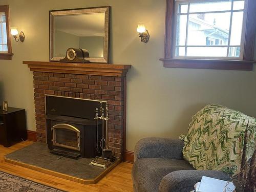 11 Belle Avenue, Souris, PE - Indoor Photo Showing Living Room With Fireplace