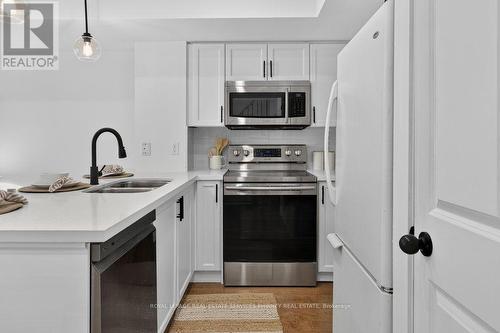 50 - 93 The Queensway, Toronto, ON - Indoor Photo Showing Kitchen With Double Sink
