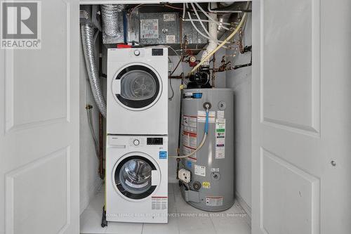 50 - 93 The Queensway, Toronto, ON - Indoor Photo Showing Laundry Room