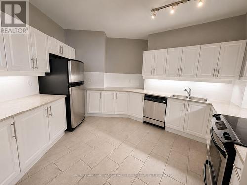 50 - 93 The Queensway, Toronto, ON - Indoor Photo Showing Kitchen With Stainless Steel Kitchen With Double Sink