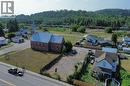 Brick structure with a steeple, set on a sizable corner lot with green space - 33 Main Street, Webbwood, ON 
