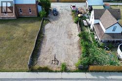 Cleart plot featuring a street-facing sidewalk and a perimeter fence - 