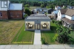 Modern commercial building featuring a flat roof and light gray siding - 