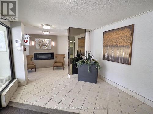 1812 - 18 Knightsbridge Road, Brampton, ON - Indoor Photo Showing Other Room With Fireplace