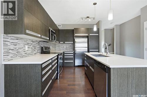 924 Stonebridge Common, Saskatoon, SK - Indoor Photo Showing Kitchen With Stainless Steel Kitchen With Double Sink With Upgraded Kitchen