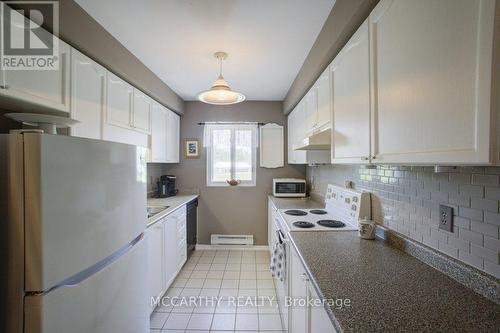 Kitchen has window and is very welcoming - 300 - 250 Robert Street, Shelburne, ON - Indoor Photo Showing Kitchen