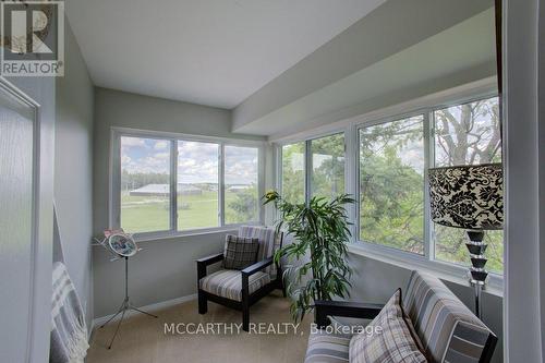 Sunroom with wrap around windows  - green view - 300 - 250 Robert Street, Shelburne, ON - Indoor Photo Showing Other Room