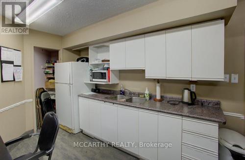 Kitchenette in common room - 300 - 250 Robert Street, Shelburne, ON - Indoor Photo Showing Kitchen With Double Sink