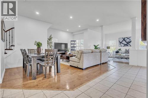 Open-concept living area featuring recessed lighting, wood-finish flooring, and white plantation shutters - 73 Fitzgerald Drive, Cambridge, ON - Indoor