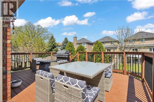 Spacious wood-finish deck with a built-in railing system - 73 Fitzgerald Drive, Cambridge, ON - Outdoor With Deck Patio Veranda