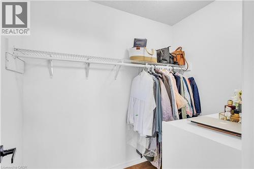 Walk-in closet featuring white wire shelving and hanging rod - 73 Fitzgerald Drive, Cambridge, ON - Indoor With Storage